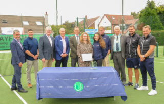 sponsors, tennis coaches and special guests with the award